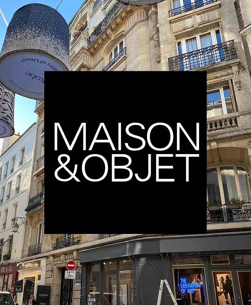 Foto eines Pariser Gebäudes im Hintergrund, im Vordergrund steht der Schriftzug "Maison & Objet"